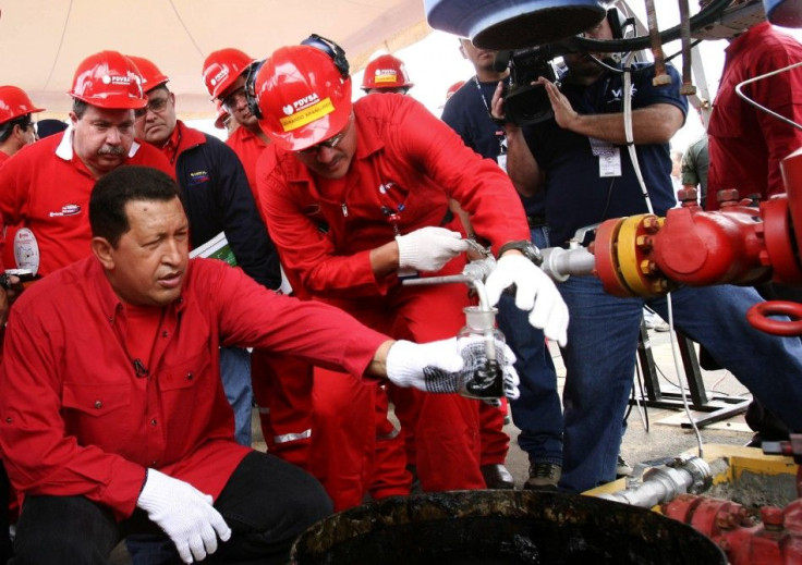 Hugo Chavez takes sample of Venezuelan oil