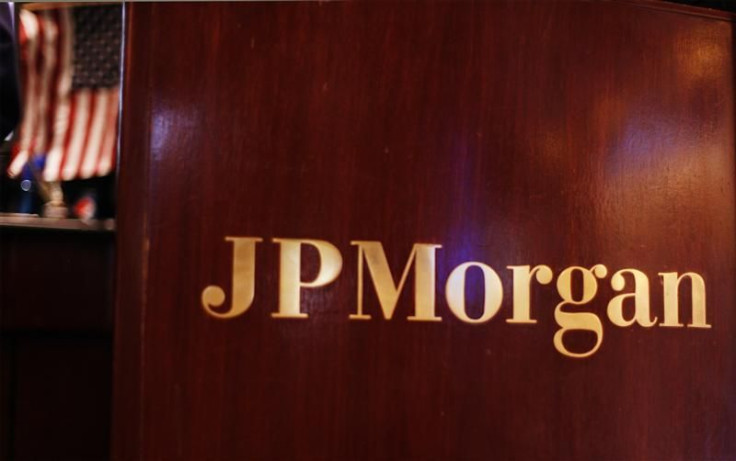 Flag hangs on the wall of the JP Morgan company stall on the floor of the New York Stock Exchange in New York