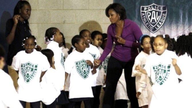 U.S. First Lady Michelle Obama dances with children at the New York Police