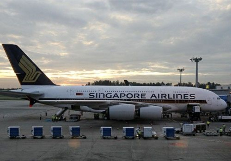 Cargo is prepared to be loaded onto the Airbus A380 superjumbo as it sits on the tarmac at Singapore's Changi Airport