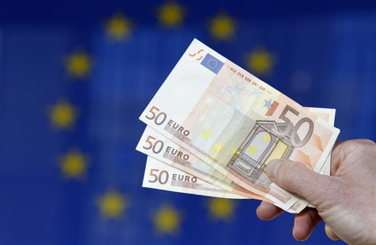 A picture illustration shows euro banknotes outside the European Commission headquarters in Brussels