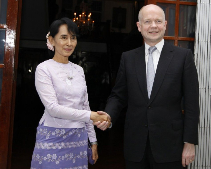 British Foreign Secretary Hague shakes hands with Myanmar pro-democracy leader Suu Kyi in Yangon