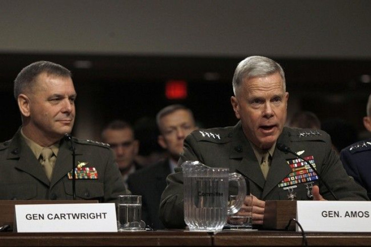 General James F. Amos, USMC, Commandant of the Marine Corps, testifies as General James E. Cartwright (L), USMC Vice Chairman of the Joint Chiefs of Staff, watches before the Senate Armed Services Committee hearing on a repeal of section 654 of title 10, 