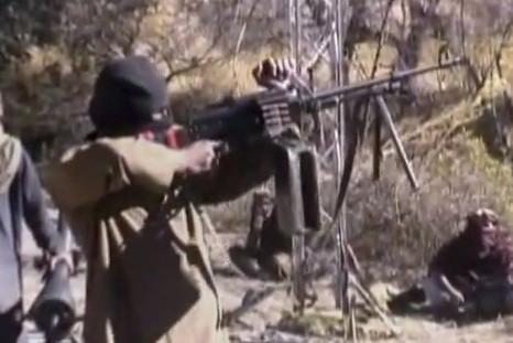 Still image taken from a video shows a Pakistani Taliban fighter firing a weapon as he receives training in Ladda, South Waziristan tribal region