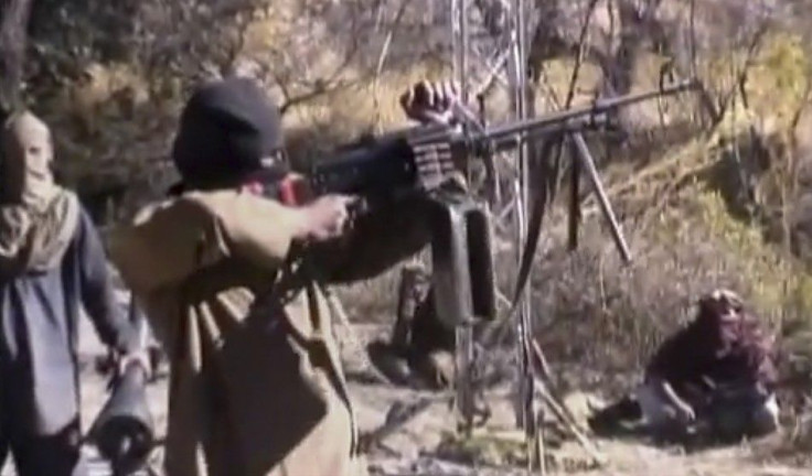 Still image taken from a video shows a Pakistani Taliban fighter firing a weapon as he receives training in Ladda, South Waziristan tribal region