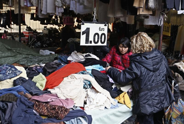 Women shop in the traditional Via Sannio market in downtown Rome