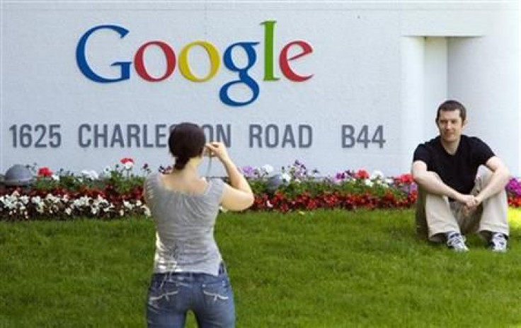 Man has his picture taken in front of Google Inc. headquarters in Mountain View
