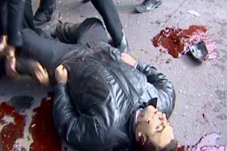 A body of a man killed during the explosion is seen in the Maidan district of Damascus