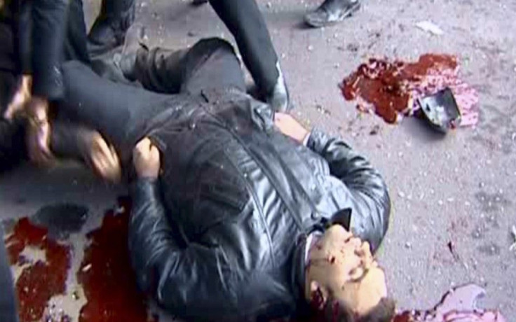 A body of a man killed during the explosion is seen in the Maidan district of Damascus