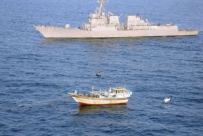 The guided-missile destroyer USS Kidd responds to a distress call from the master of the Iranian-flagged fishing dhow Al Molai, who claimed he was being held captive by pirates in the Arabian Sea