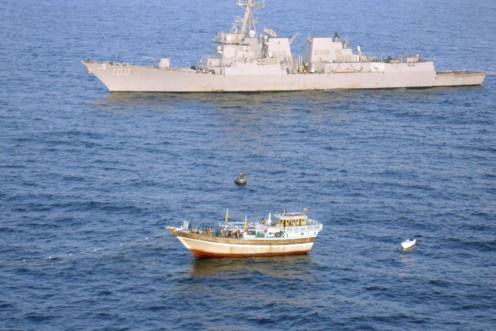 The guided-missile destroyer USS Kidd responds to a distress call from the master of the Iranian-flagged fishing dhow Al Molai, who claimed he was being held captive by pirates in the Arabian Sea