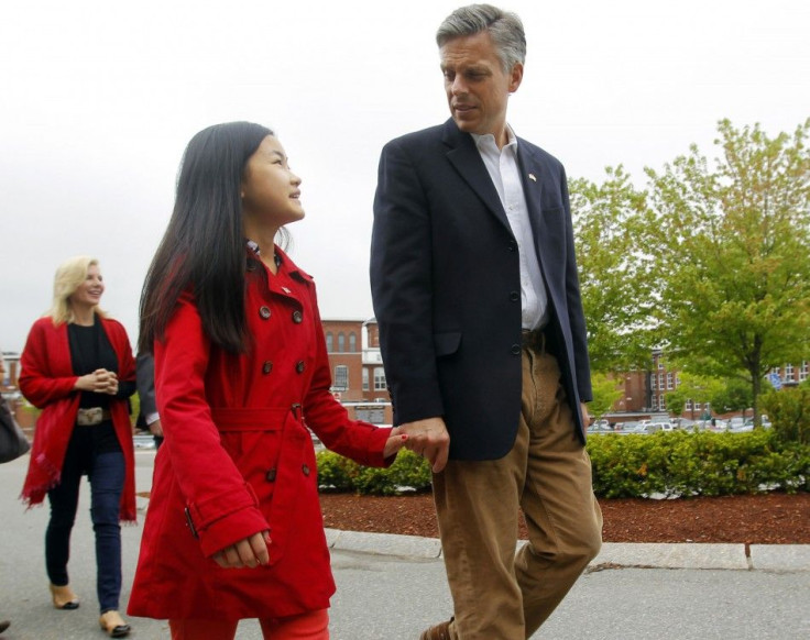 Former U.S. Ambassador to China and possible Republican Presidential candidate Huntsman walks with his daughter Mei in Manchester