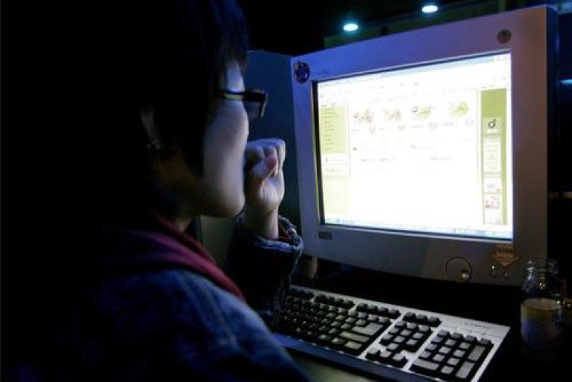 A South Korean surfs the Web at an Internet cafe in Seoul