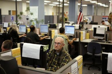 Johnson looks for warehouse work online at the Employment Development Department of California service office in San Francisco