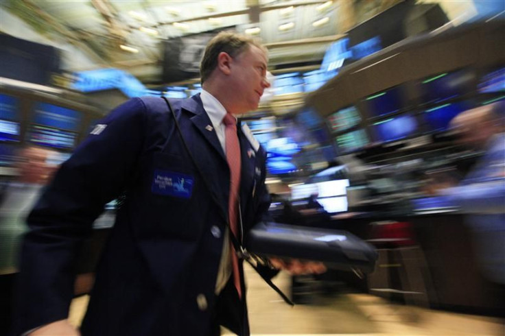 Traders work on the floor of the New York Stock Exchange January 6, 2012.