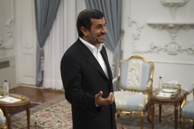Iranian President Ahmadinejad speaks with Iran&#039;s Foreign Minister Salehi in Tehran