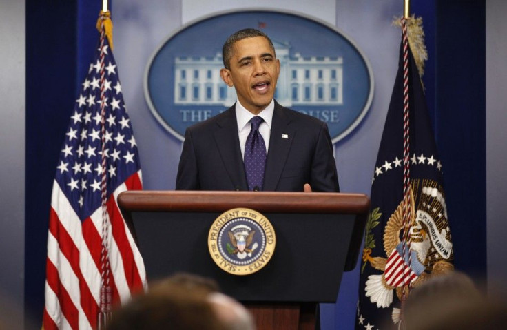 U.S. President Barack Obama speaks to the press after signing into law a two-month payroll tax cut extension at the White House in Washington December 23, 2011.