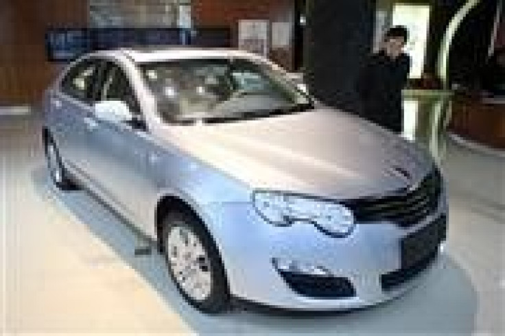 A customer looks at a Roewe 550 car at a Chinese automaker SAIC Motor Corp dealership in Shanghai