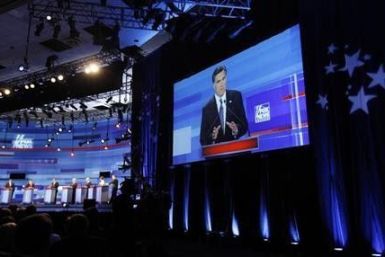 Republican presidential candidate, former Massachusetts Governor Mitt Romney, is displayed on a large screen as she speaks during the Republican Party presidential candidates debate in Sioux City, Iowa