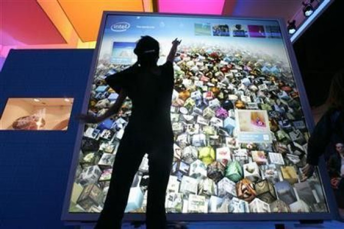 Karen Nguyen interacts with a display at the Intel booth during the 2010 International Consumer Electronics Show (CES) in Las Vegas, Nevada, January 8, 2010.