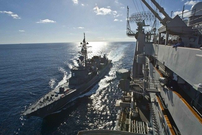 Japan Maritime Self Defence Force destroyer Ikazuchi (L) sails alongside the USS George Washington during their military maneuvers known as Keen Sword 2011, in the Pacific Ocean December 5, 2010.