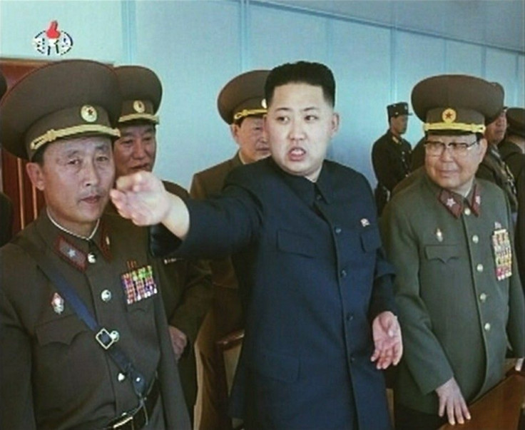  Kim Jong-un speaks while surrounded by soldiers 