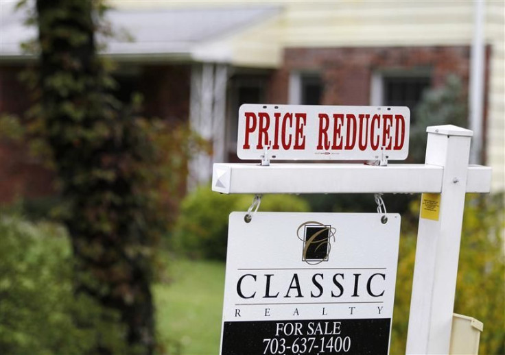 A "Price Reduced" sign is displayed on a home for sale in northern Virginia suburb of Vienna