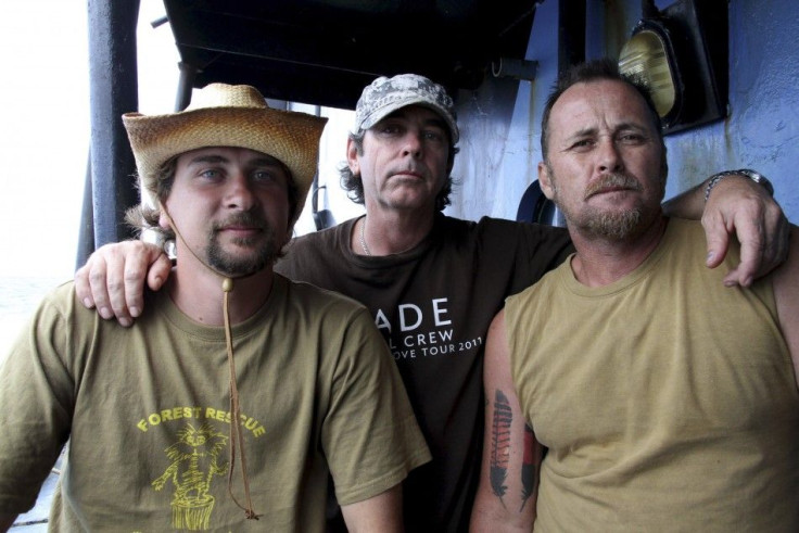 Handout picture shows activists from Forest Rescue posing for a photograph aboard the Sea Shepherd Conservation Society.