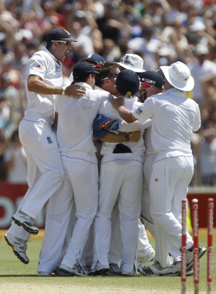 England's players celebrate winning after dismissing the final wicket of Australia's Siddle during the final day of the second Ashes cricket test in Adelaide.