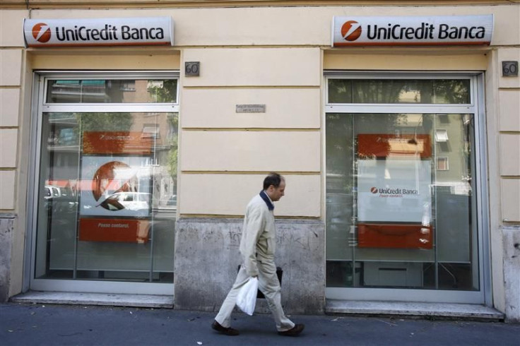 A man walks past the entrance to a Unicredit bank office in Rome