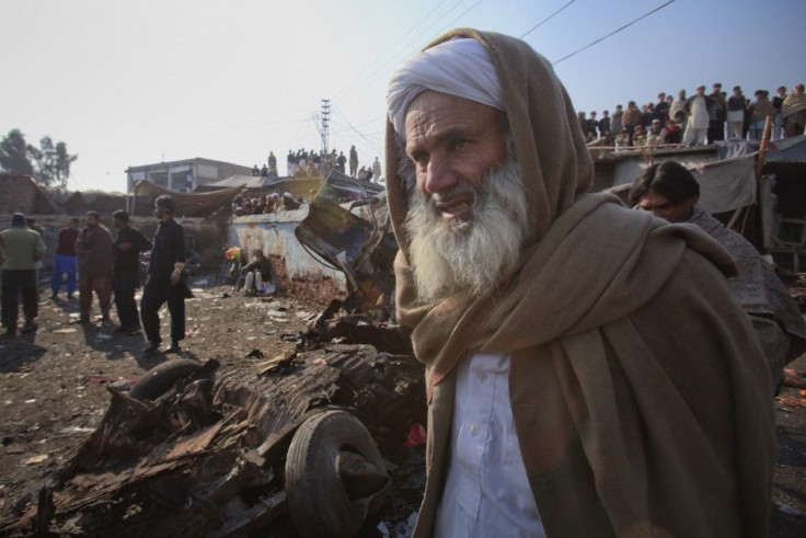 A Pashtun tribesman stands at the site of a bomb explosion in Jamrud bazaar, about 25 km (15 miles) west of Peshawar in northwest Pakistan
