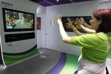 Liz Miller of Los Angeles plays Kinect for Star Wars at the Microsoft XBOX 360 booth at E3 in Los Angeles, California June, 7 2011.