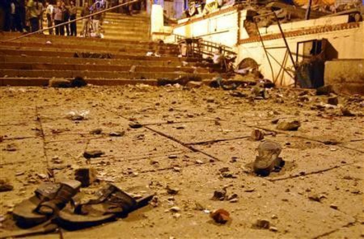 Onlookers stand at the site of a blast in the northern Indian city of Varanasi 