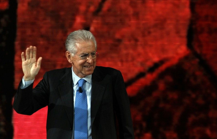 Italian Prime Minister Mario Monti waves as he leaves the television show &quot;Che tempo che fa&quot; in Milan