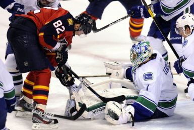 Florida Panthers' Kopecky tries to score against Vancouver Canucks goalie Luongo during their NHL hockey game in Sunrise