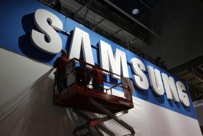 Workers prepare the booth for Samsung at the Consumer Electronics Show opening in Las Vegas.