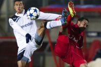 FC Twente's Landzaat fights for the ball with Tottenham Hotspur's Jenas during their Champions League Group A soccer match in Enschede.