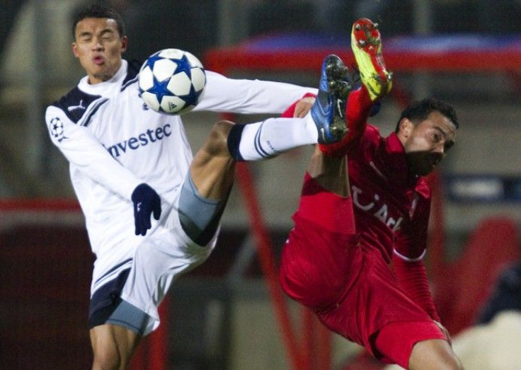 FC Twente's Landzaat fights for the ball with Tottenham Hotspur's Jenas during their Champions League Group A soccer match in Enschede.