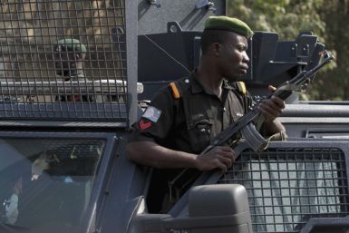 Police stand watch over protesters in Nigeria's capital, Abuja