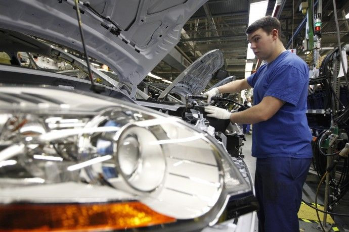 An employee works at the assembly line of the Ford car factory of Saarlouis