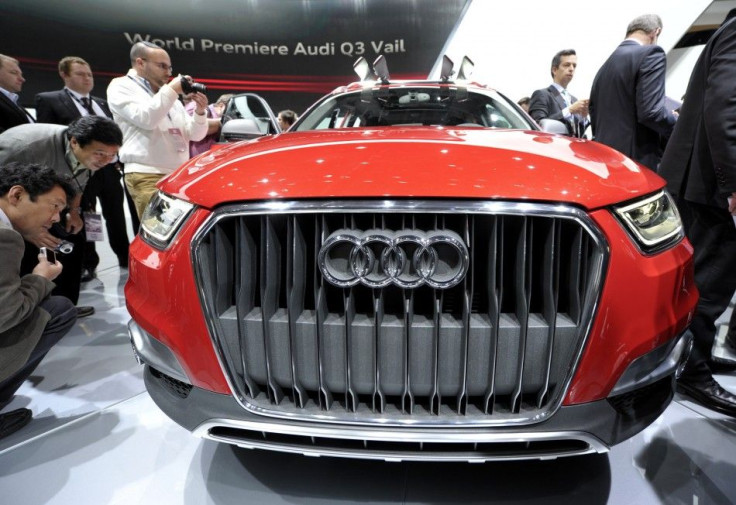 Members of the media get a close-up view of the Audi Q3 Vail during the first press preview day for the North American International Auto Show in Detroit, Michigan, January 9, 2012.