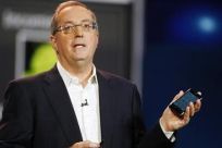 Paul Otellini, president and CEO of Intel Corporation, holds an Intel smartphone reference design as he gives a keynote address during the 2012 International Consumer Electronics Show (CES) in Las Vegas, Nevada, January 10, 2012.