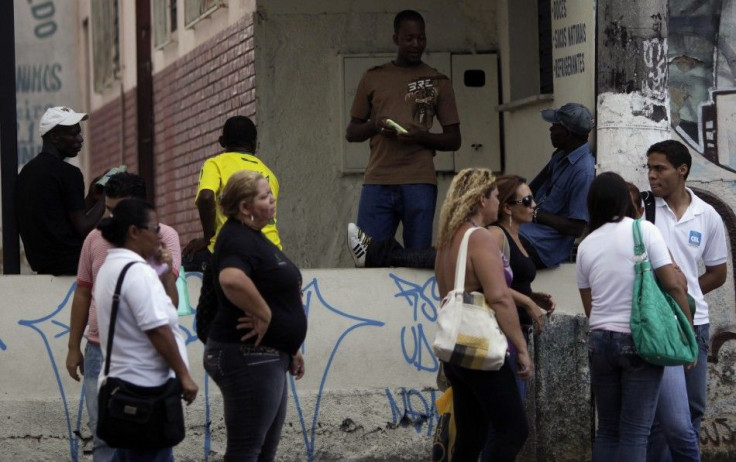 Haitians talk near a Pastoral do Migrante shelter in Manaus