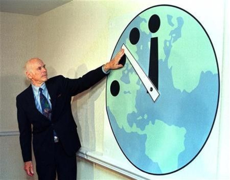Leonard Reiser, chairman of the Bulletin of the Atomic Scientists and member of the Manhattan Project adjusts the Doomsday Clock.