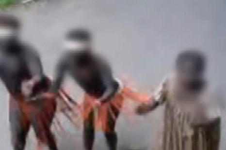 Jarawa Tribe members dance for tourists