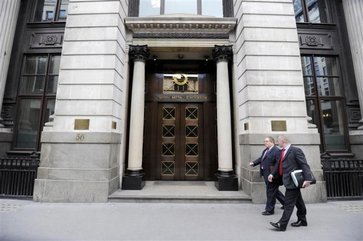 Men walk past the London Metal Exchange (LME) in London