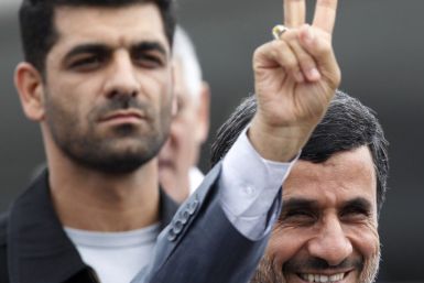 Iran&#039;s President Mahmoud Ahmadinejad gestures next to his bodyguard at Havana&#039;s Jose Marti airport