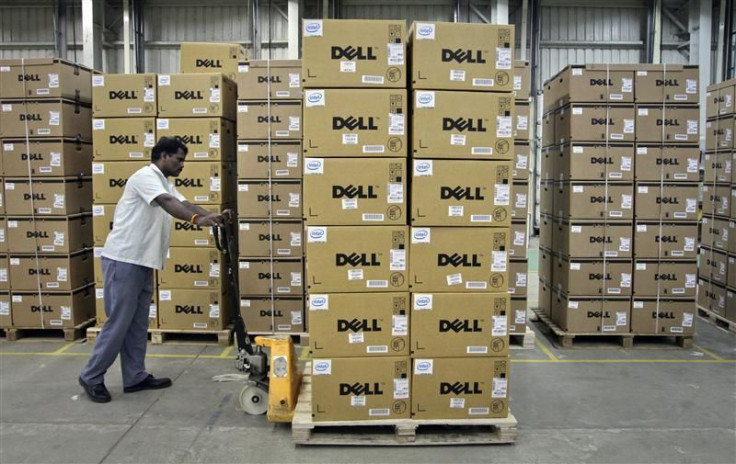 File photograph of a man pushing a trolley full of Dell computers in Sriperumbudur Taluk