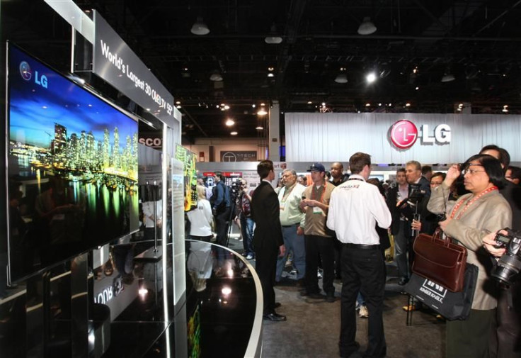 Showgoers look at a display of 55-inch 3D OLED televisions at the LG Electronics booth during the 2012 International Consumer Electronics Show in Las Vegas