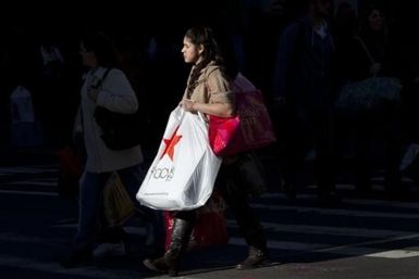 A Black Friday shopper crosses 34th Street outside Macy&#039;s in Herald Square in New York